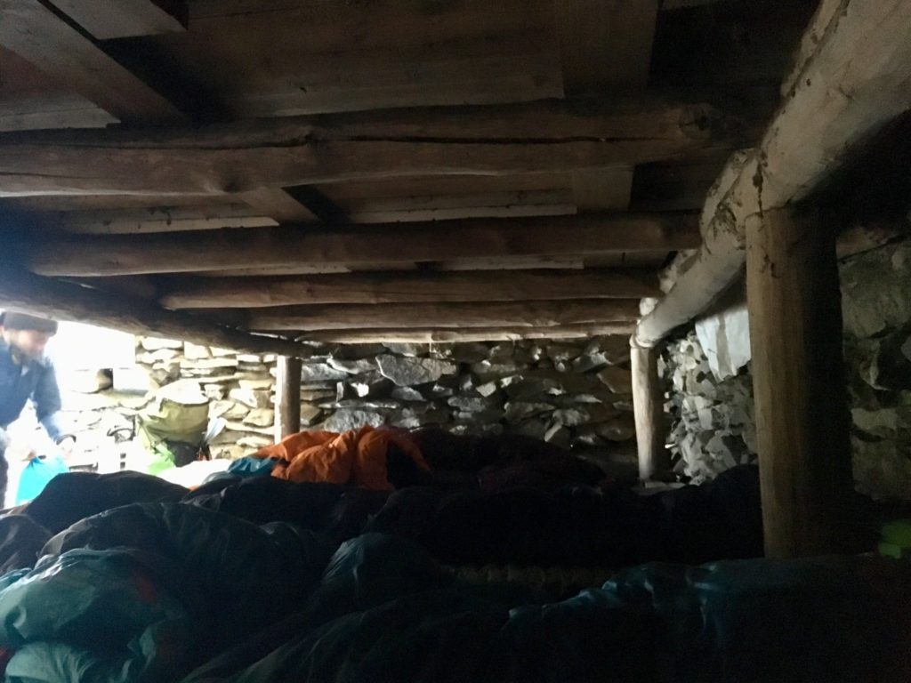 Squeezed together in the shelter next to strangers on the first tier of bunks