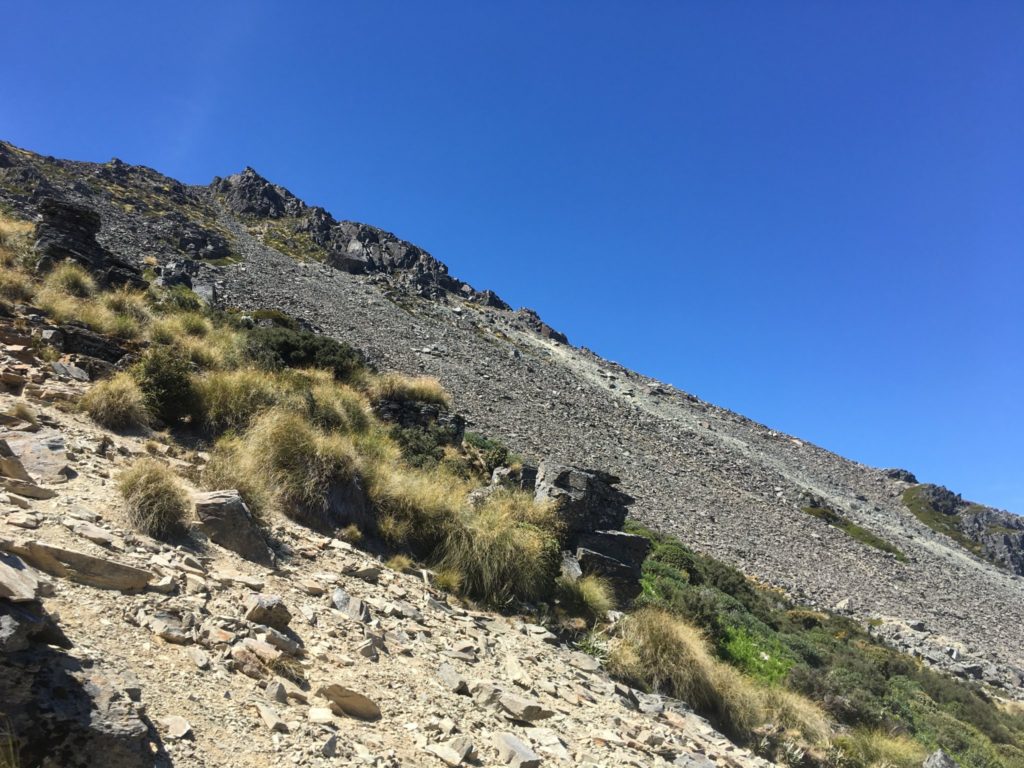 Climbing up a mountain of rock scree